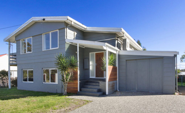 29-suburbs-where-you-can-make-a-seachange-grey-two-storey-house